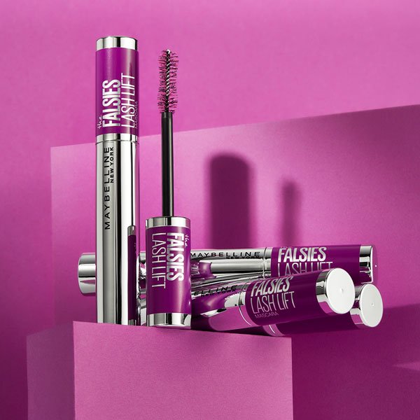 Maybelline The Falsies Lash Lift Mascaras in front of purple background