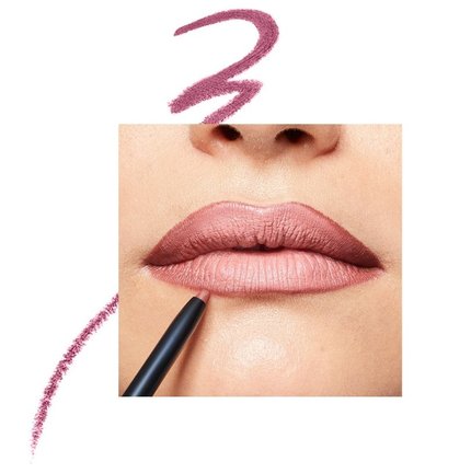 Close up of nude pink lip pencil lining woman's lips