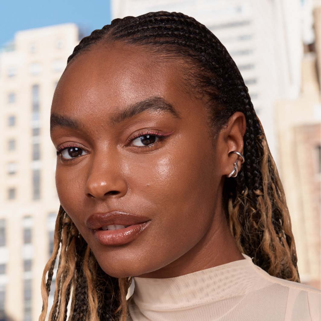 Close-up view of a person wearing Lifter Serum Concealer