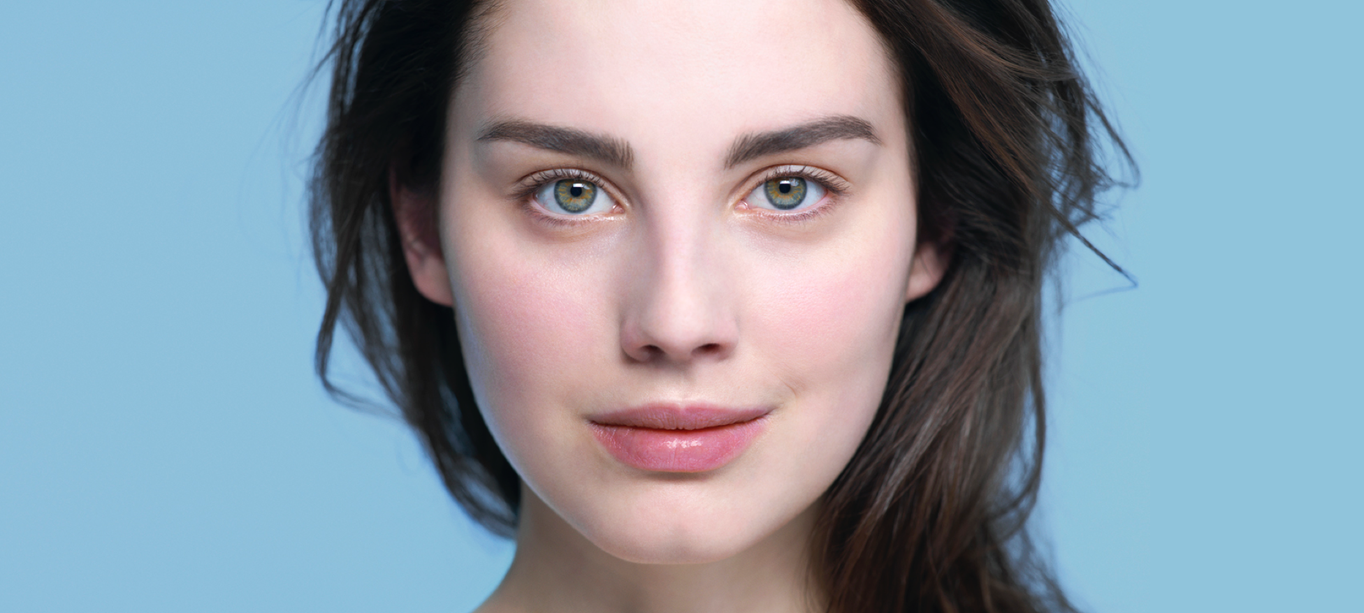 Close up of a woman on a blue background
